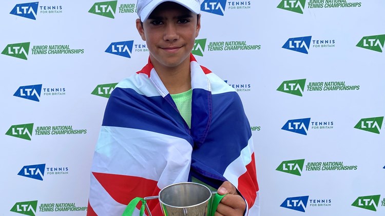 Niall posing with his cup after winning tennis tournament 