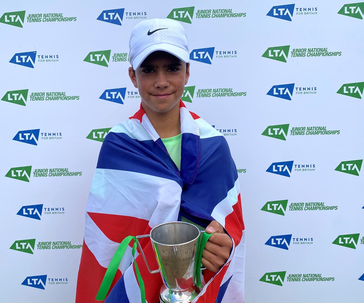 Niall posing with his cup after winning tennis tournament 