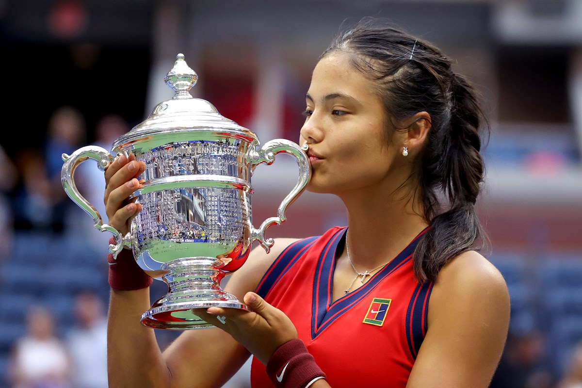 Female kissing a trophy
