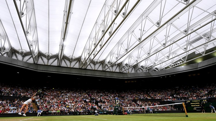 Tennis match in a stadium full of fans