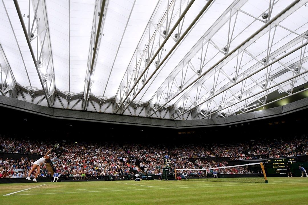 Tennis match in a stadium full of fans