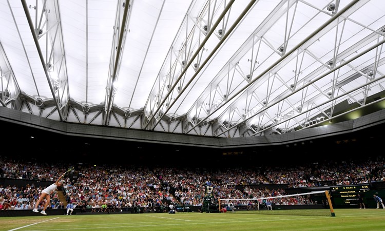 Tennis match in a stadium full of fans