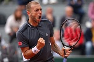 Dan Evans gives a roaring fist pump after reaching the second round at the French Open in 2022