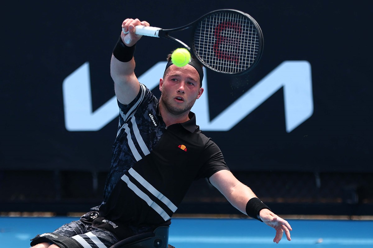 Alfie Hewett hitting a ball with a racket