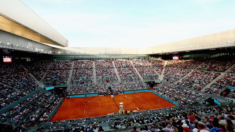 Clay court match in a stadium