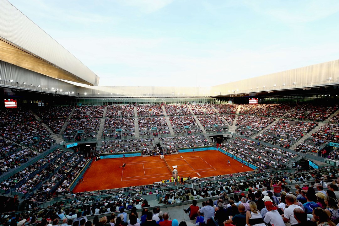 Clay court match in a stadium