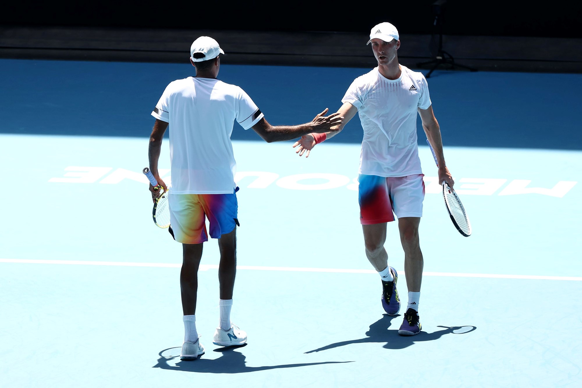 Two tennis players shaking hands