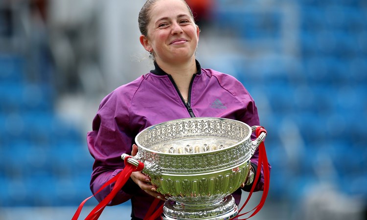 Female tennis player holding a trophy