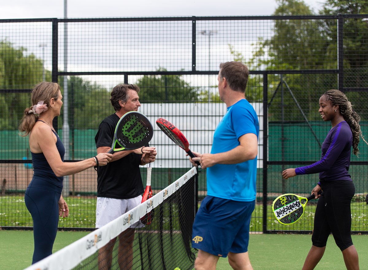 4 padel players talking after a game of padel