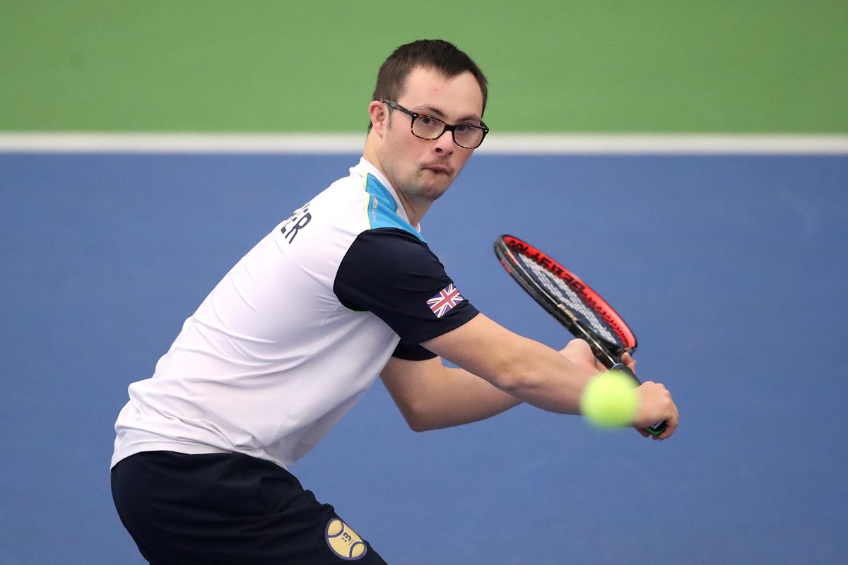 Young boy playing learning disability tennis