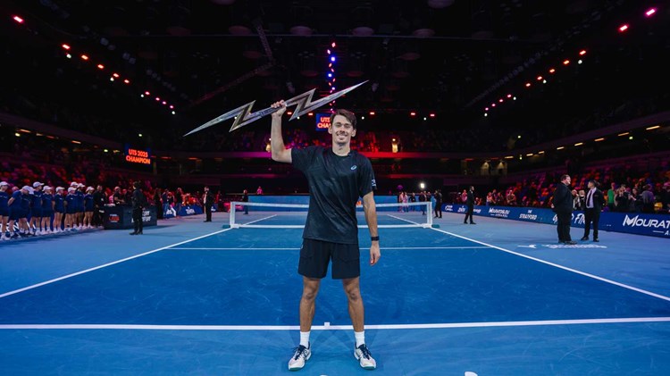 Alex de Minaur holding the 2025 Ultimate Tennis Showdown trophy