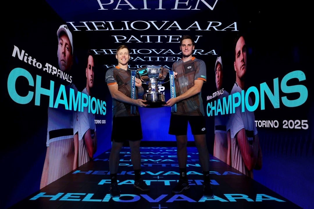 Harri Heliovaara and Henry Patten holding the 2025 Nitto ATP Finals doubles title