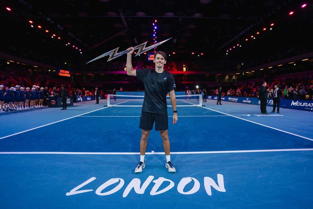 Alex de Minaur holding the 2025 Ultimate Tennis Showdown trophy