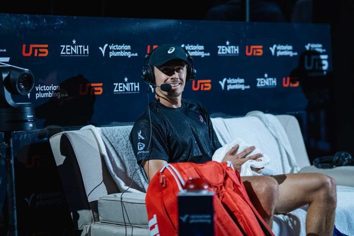 Alex de Minaur wearing a headset during an interview at the Ultimate Tennis Showdown