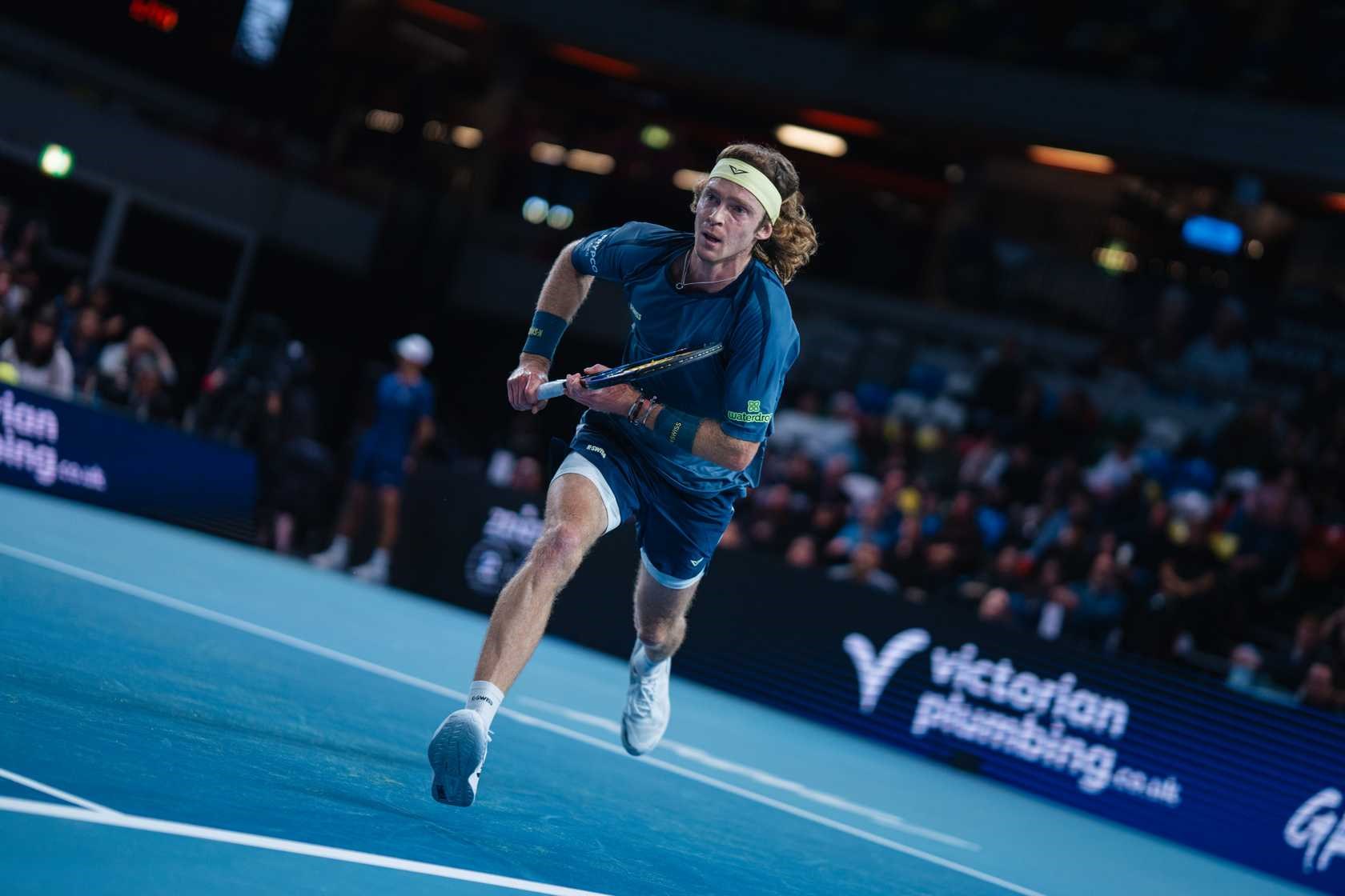 Andrey Rublev chases a ball during the 2025 Ultimate Tennis Showdown
