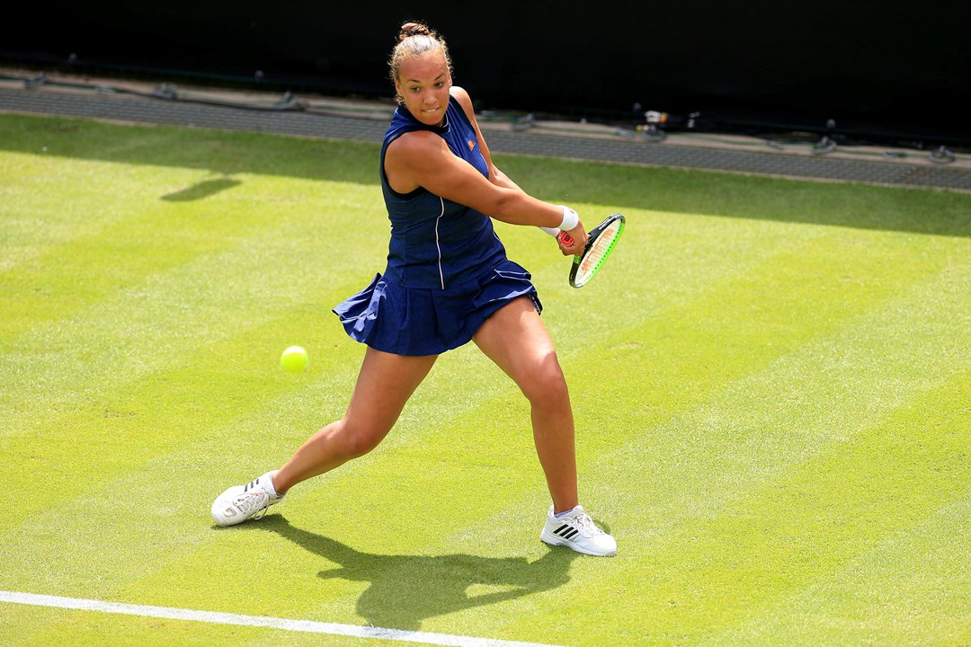 Freya Christie swinging a tennis racket