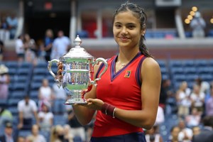 Female tennis player holding a trophy