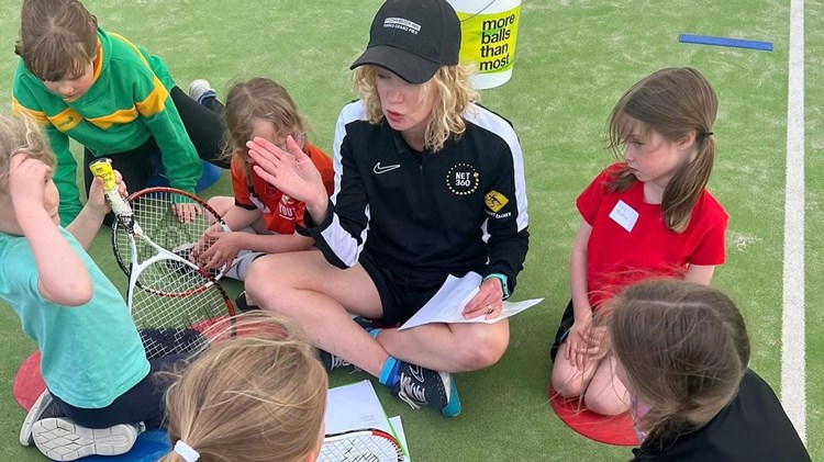 Coach Emily James pictured delivering a Prime Video LTA Youth Girls session.