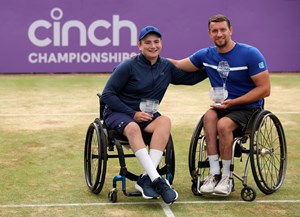 Andrew Penney celebrates with his runner-up trophy in the cinch Championships doubles