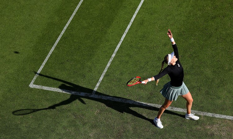 Harriet Dart of Great Britain serves during her first round women's doubles match with fellow Brit Heather Watson against Jelena Ostapenko of Latvia and Cori Gauff of USA 