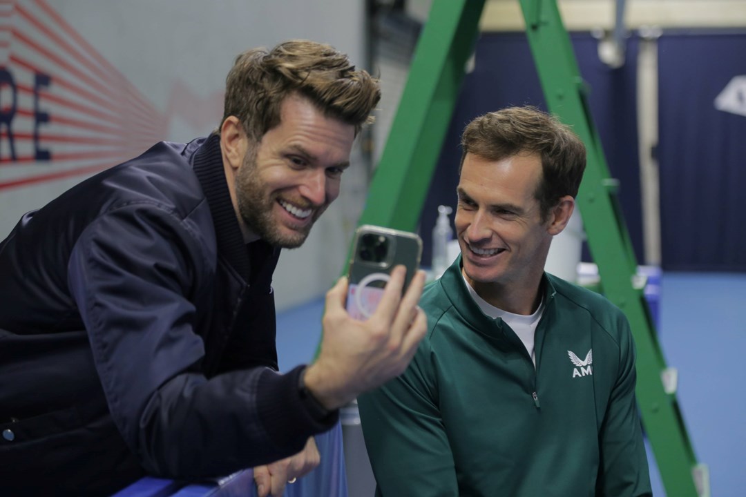 Joel Dommett andAndy Murray laughing on a video call