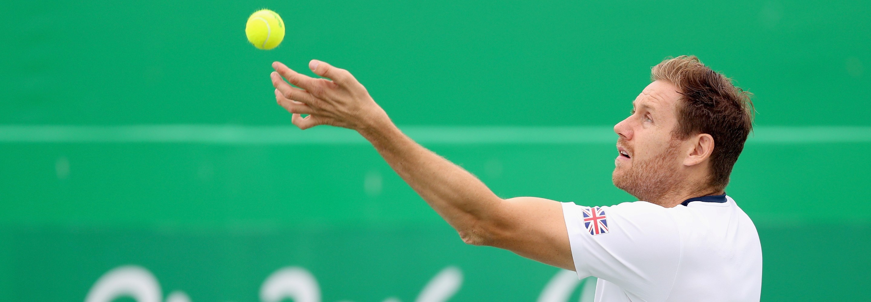 Antony Cotterill of Great Britain serves