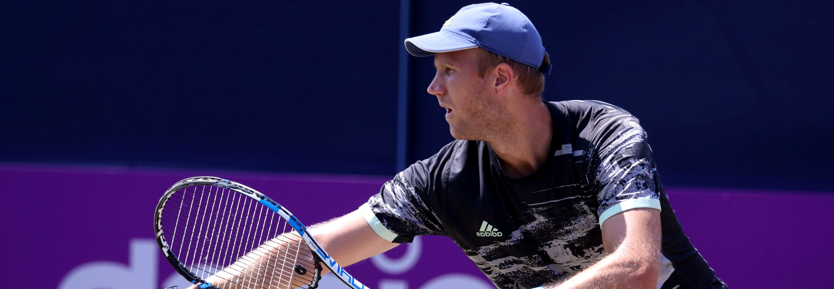 Dominic Inglot of Great Britain serves