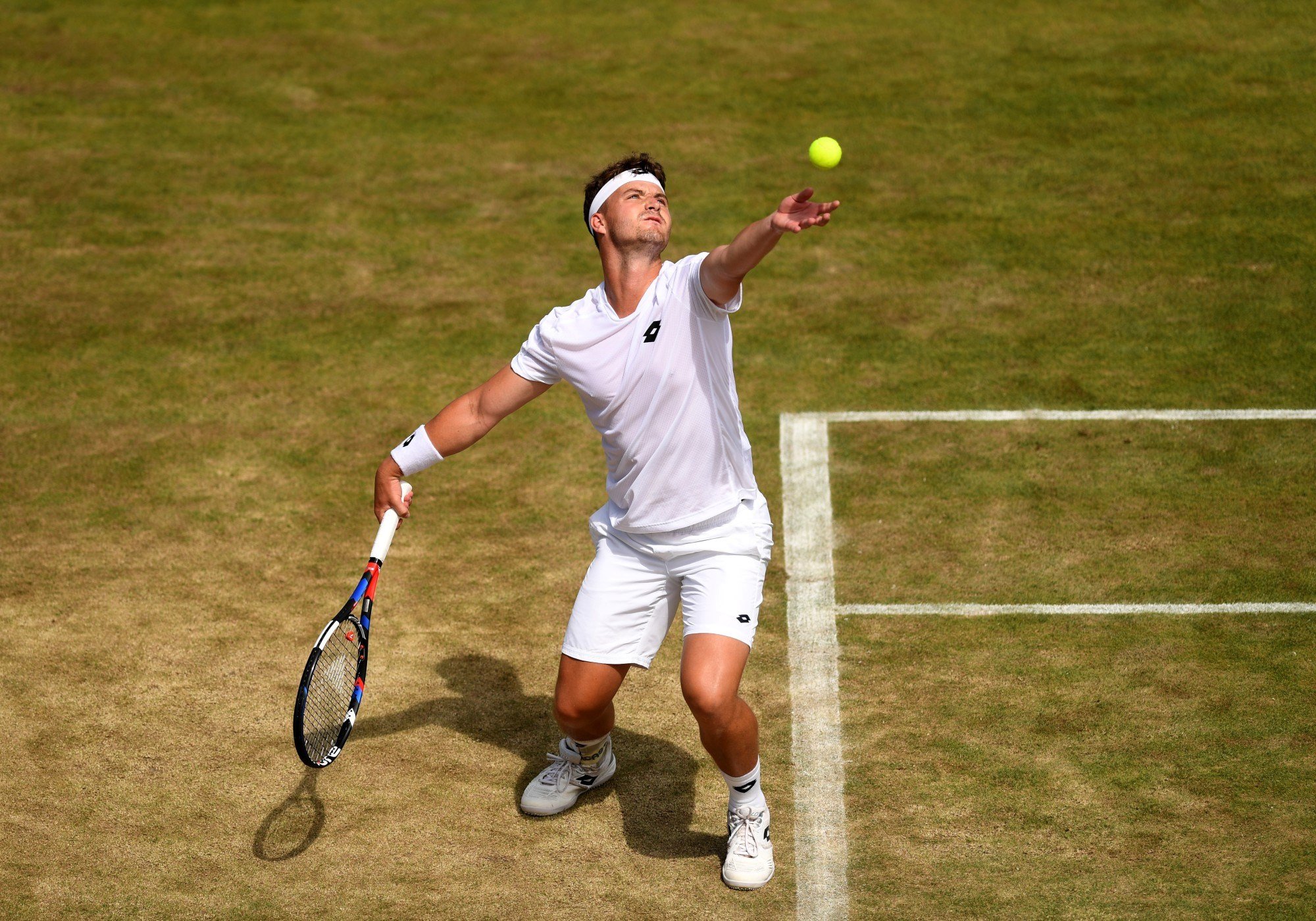 Jonny O'Mara of Great Britain serves