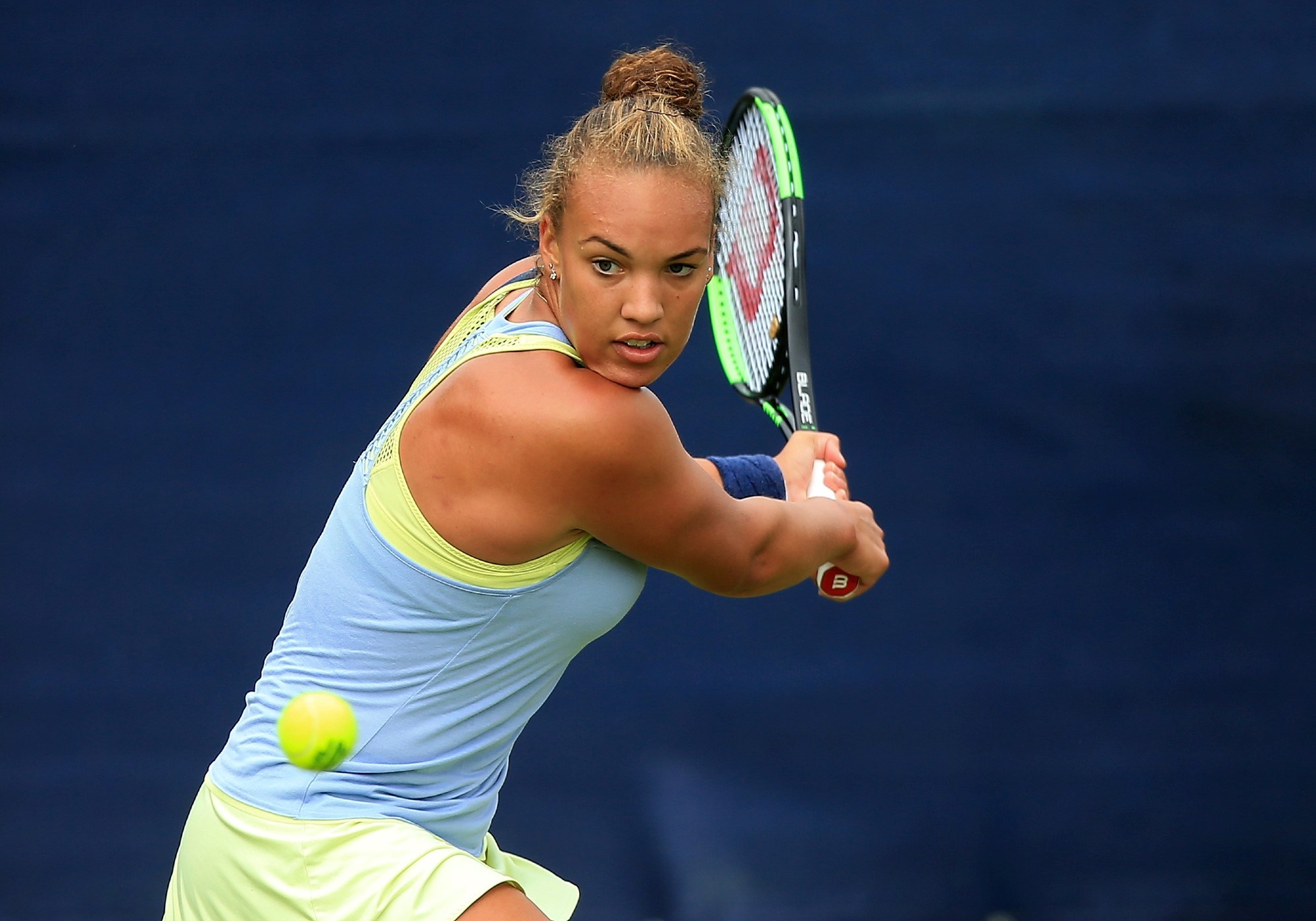 Freya Christie of Great Britain hits a backhand 