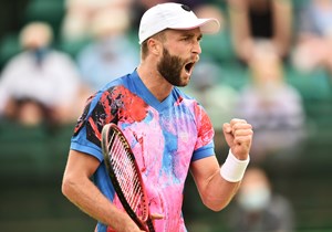 Liam Broady of Great Britain celebrates as he wins a point