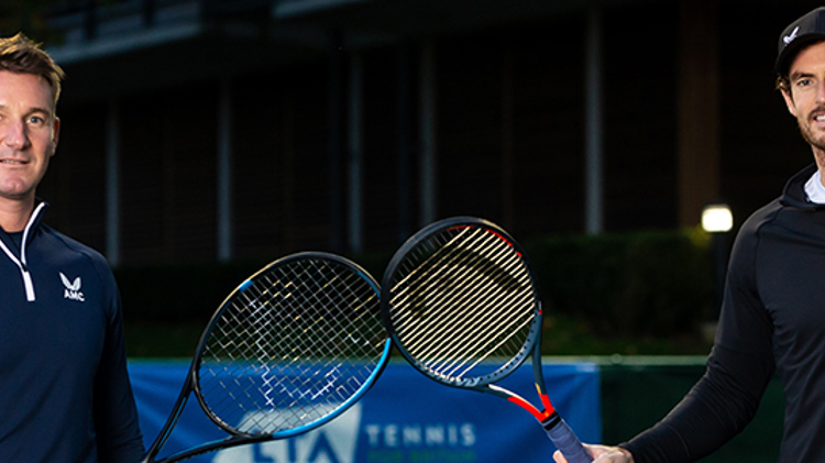 Andy Murray and Scott Lloyd touching rackets at the National Tennis Centre