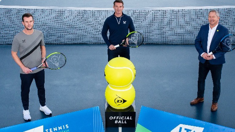 Leon Smith, Scott Lloyd and Steve Heatley holding tennis rackets on a court