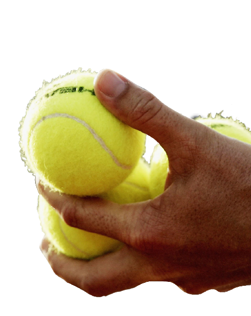 Cut out of tennis balls being held by a person