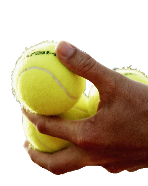 Cut out of tennis balls being held by a person