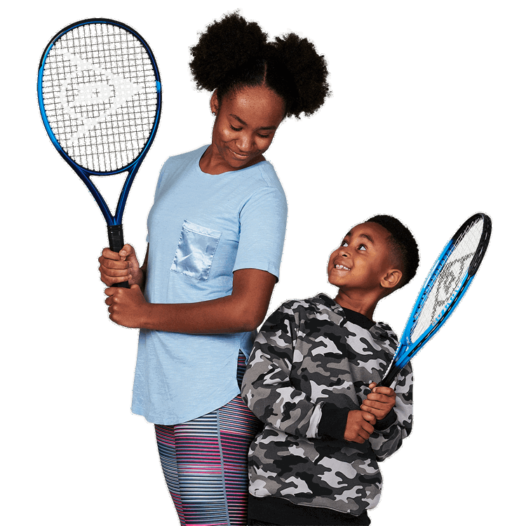 Boy looking up at a girl holding a tennis racket