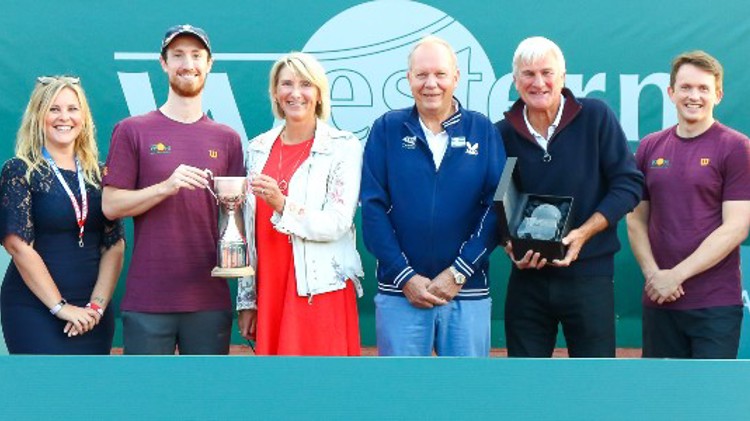 A group of people presenting their trophie