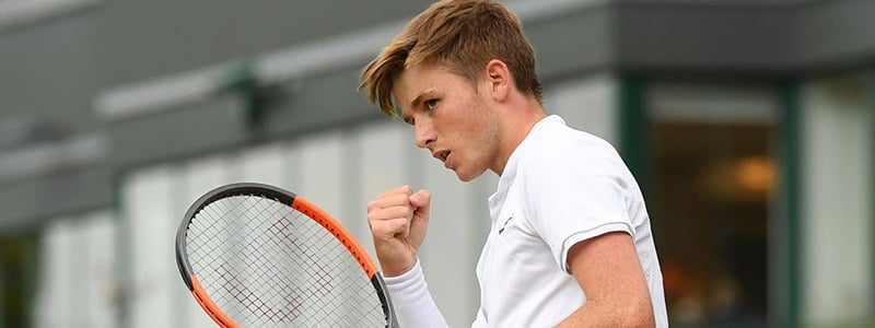 Aiden McHugh celebrating a win at Wimbledon
