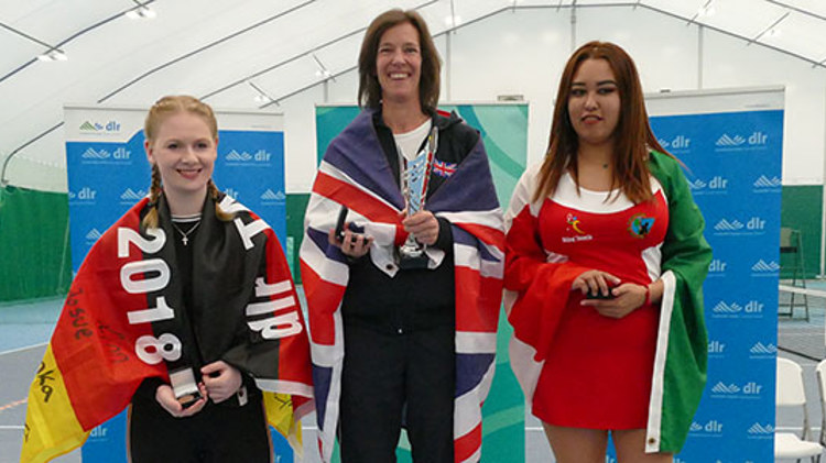 Tennis players on the podium at the International Blind Tennis tournament in 2019