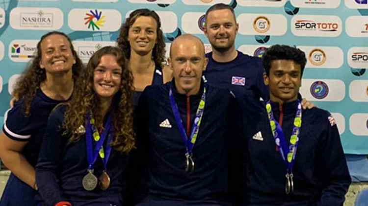 Great British players smiling at the 2019 world deaf tennis championships with medals round neck