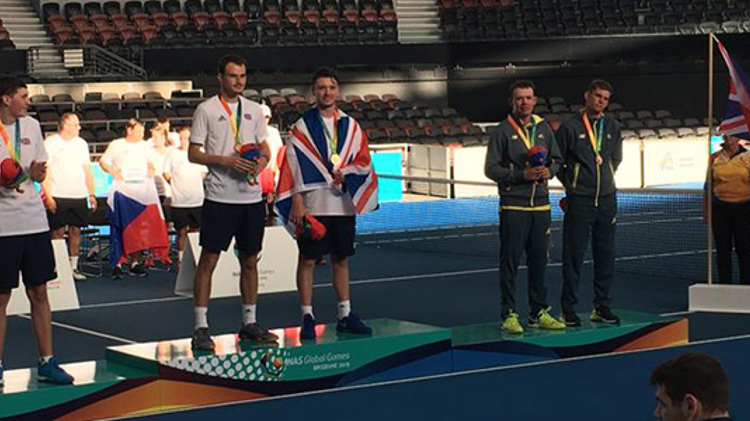 Tennis players at a medal ceremony for the 2019 INAS games