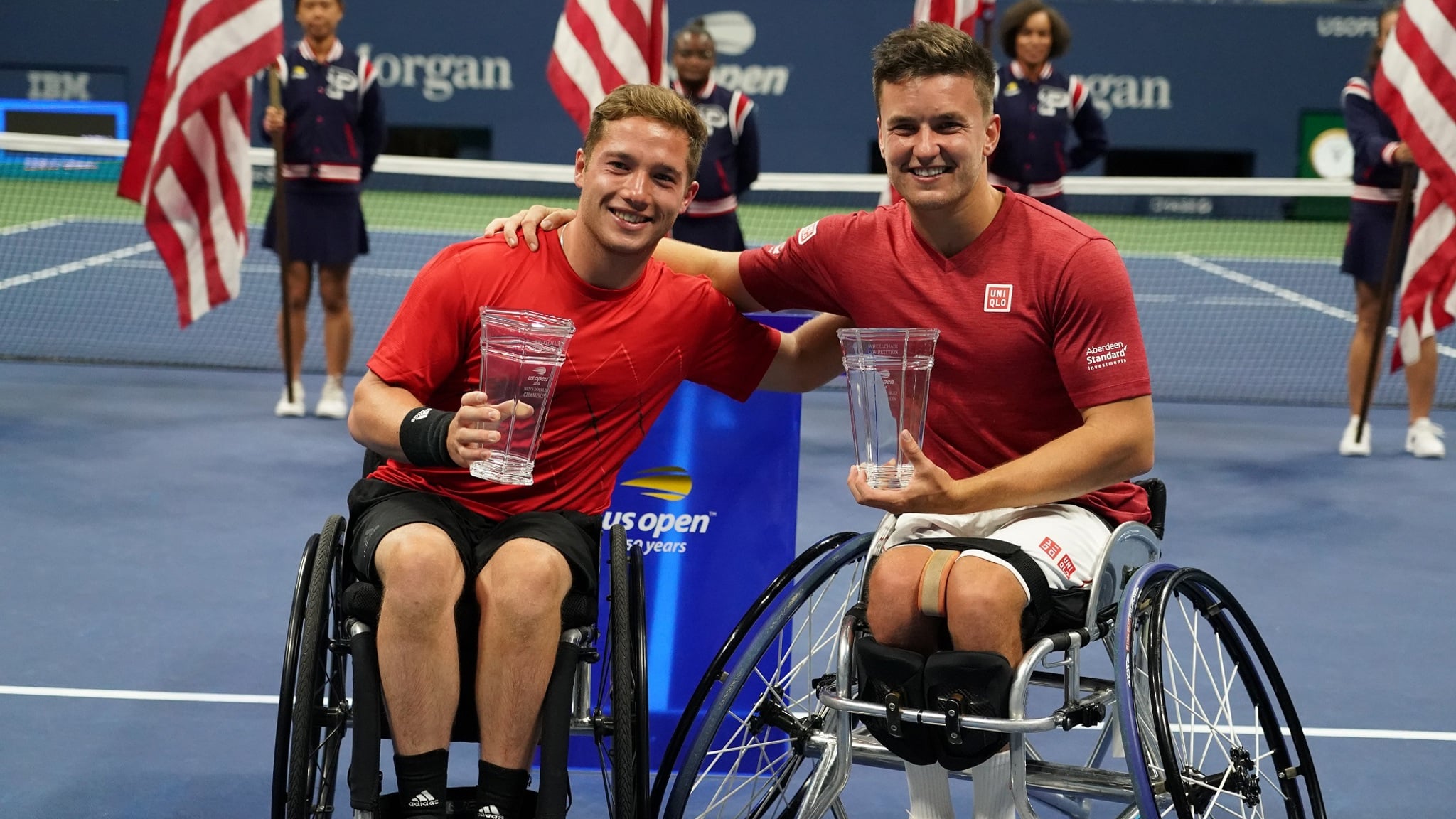 Hewett and Reid smiling holding their trophies