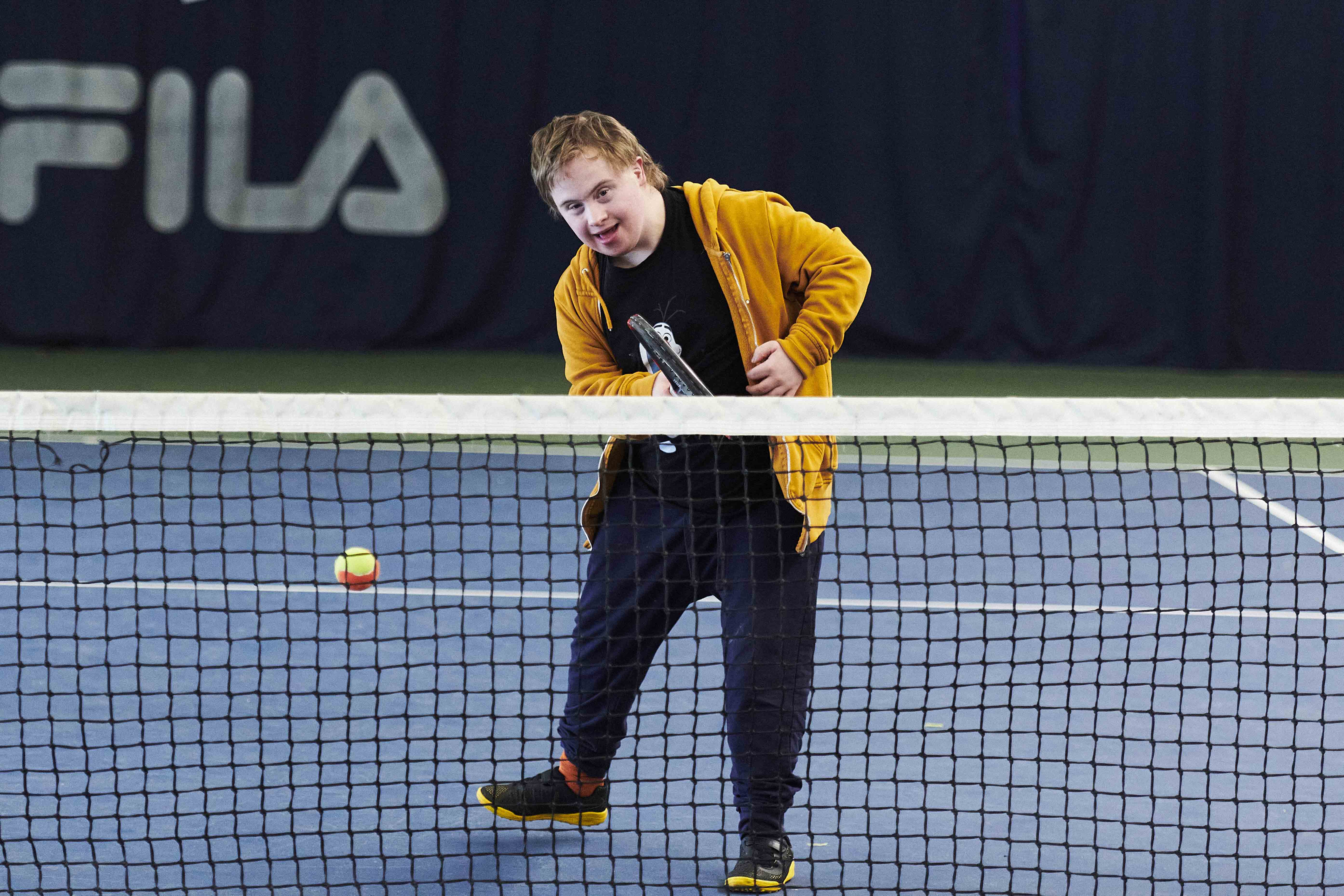 Learning disability player hitting forehand.jpg