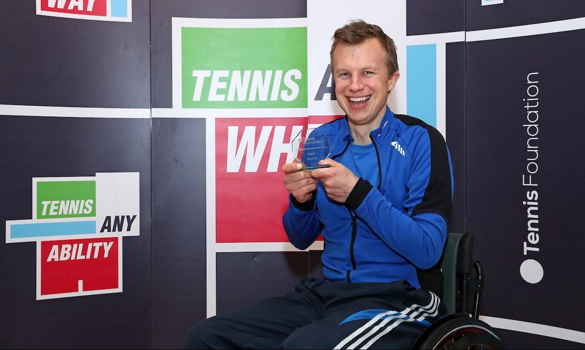 Philip holding his award