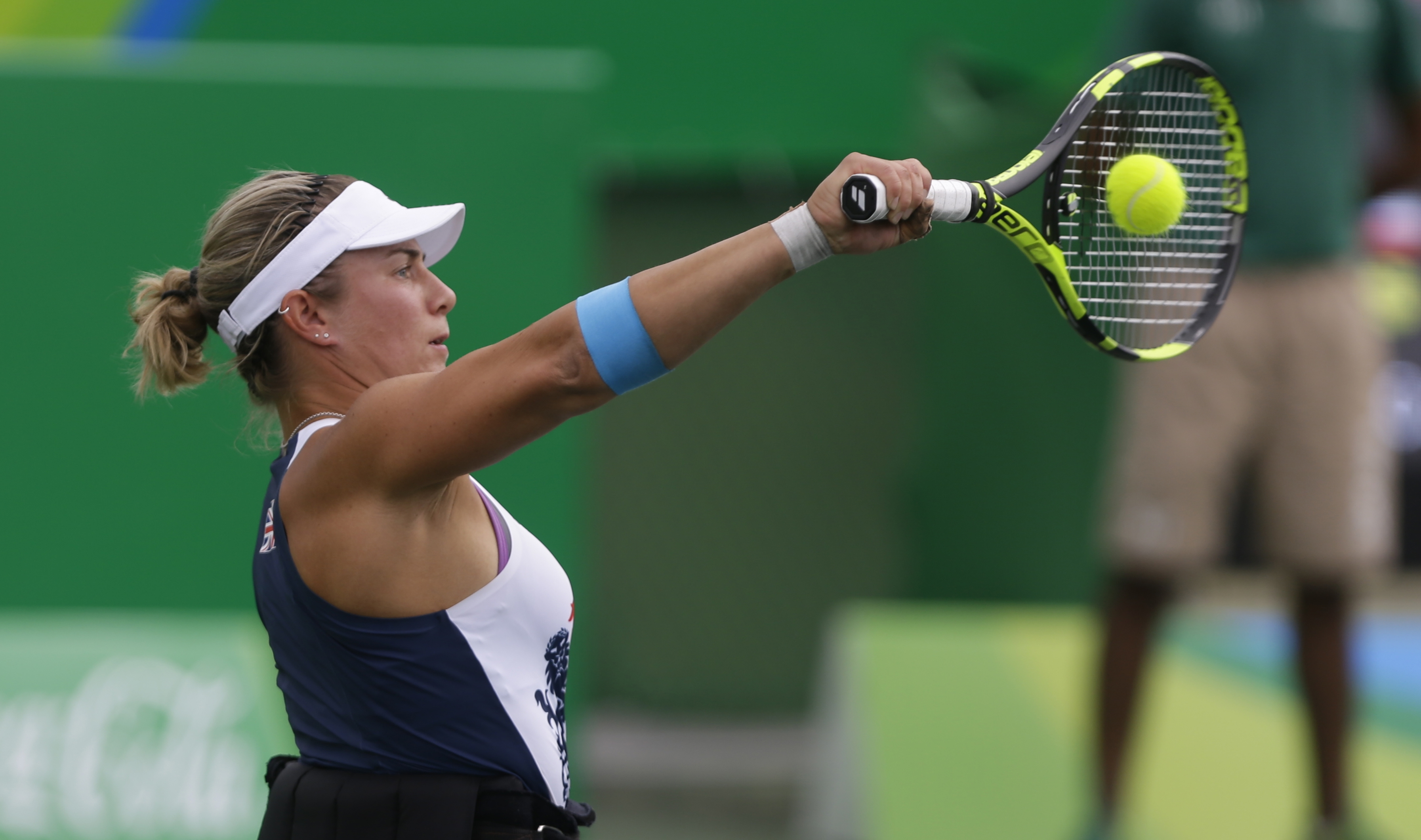 Lucy Shuker playing a tennis shot at the 2016 Rio Paralympics