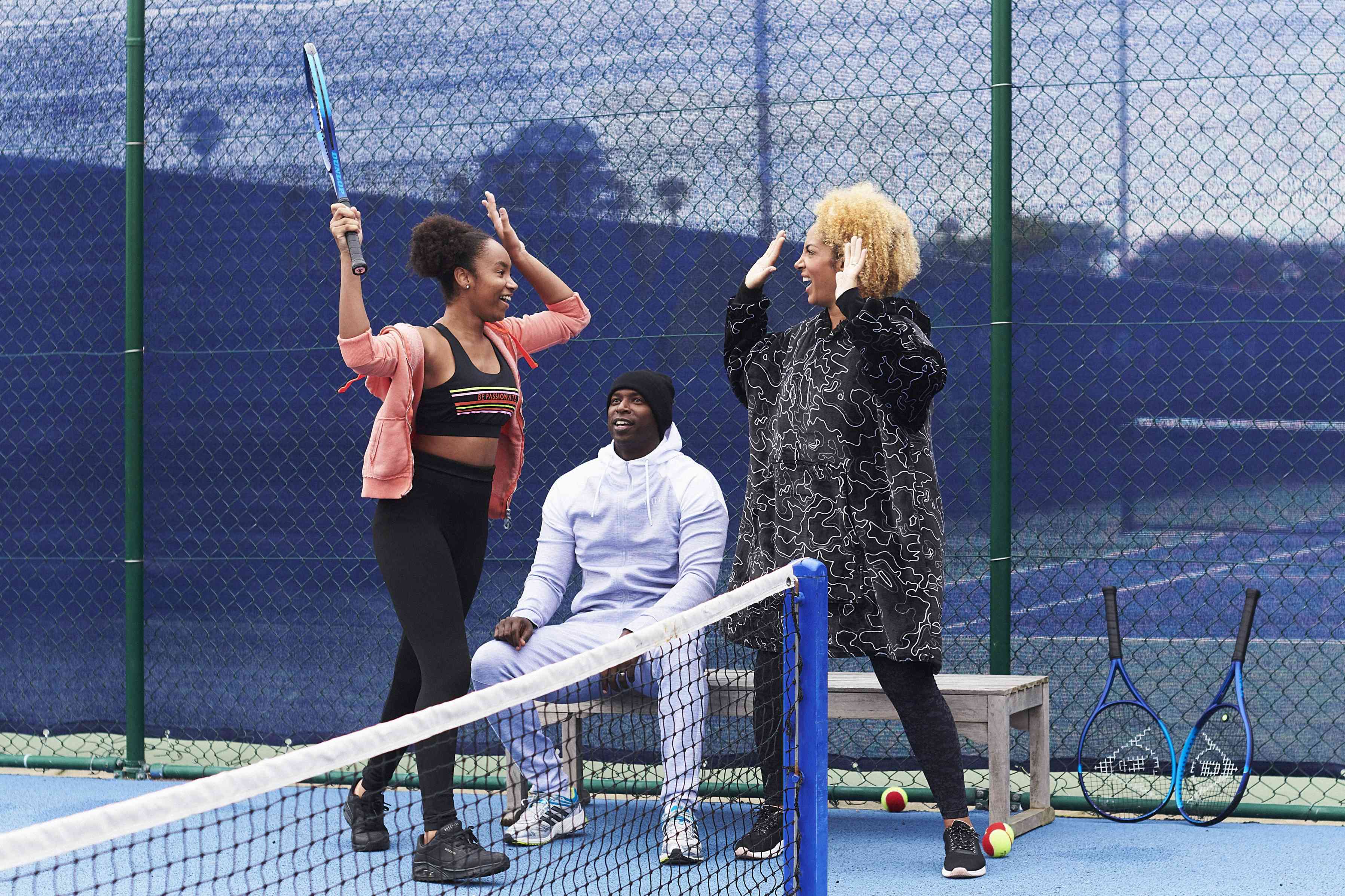 Parents and child celebrating on court.jpg
