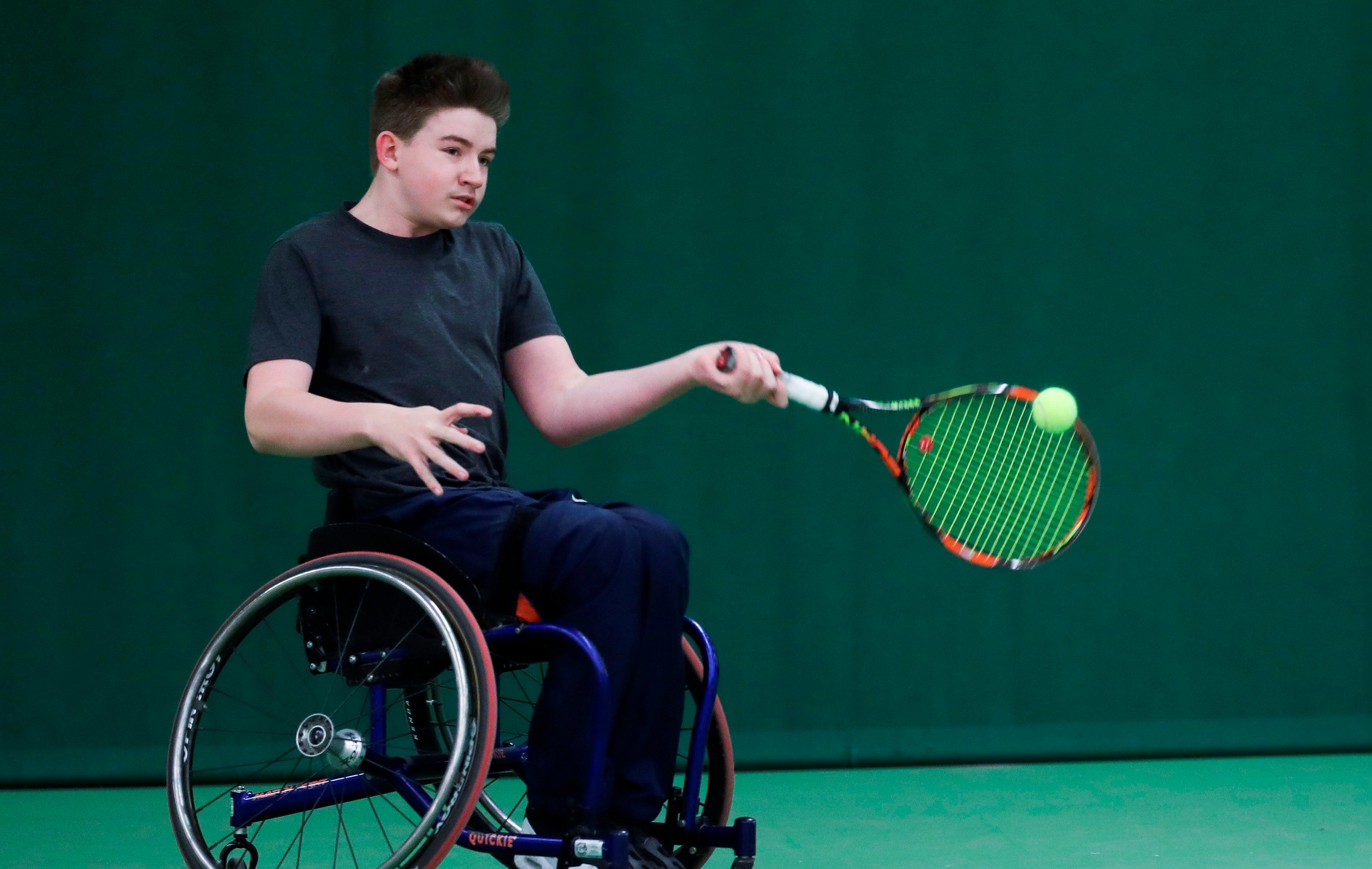 Ruairi Logan hitting a forehand