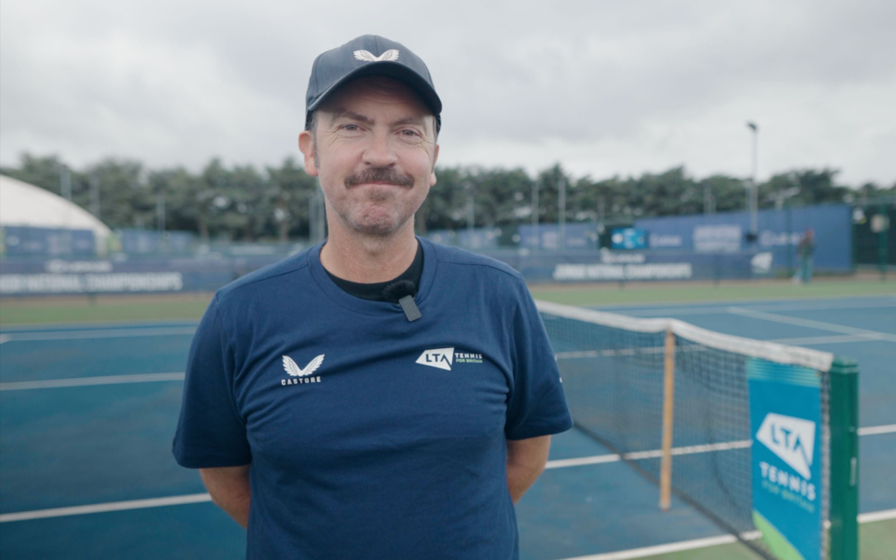 A headshot of coach, Luke Milligan