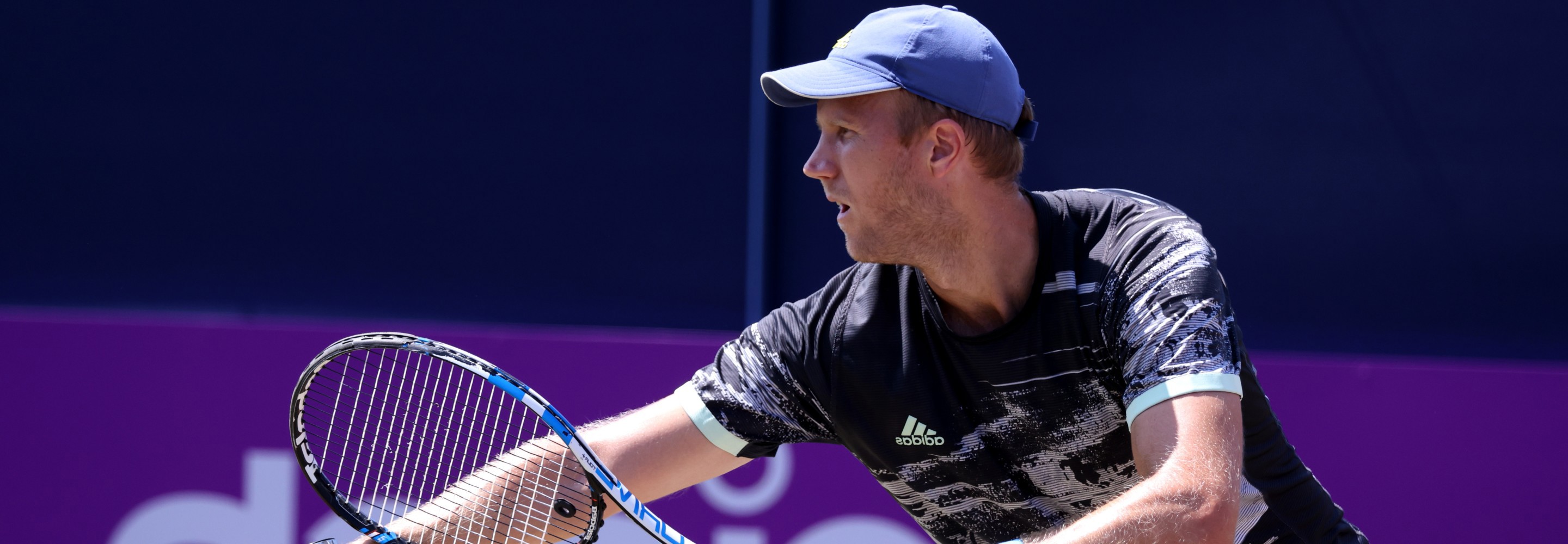 Dominic Inglot of Great Britain serves