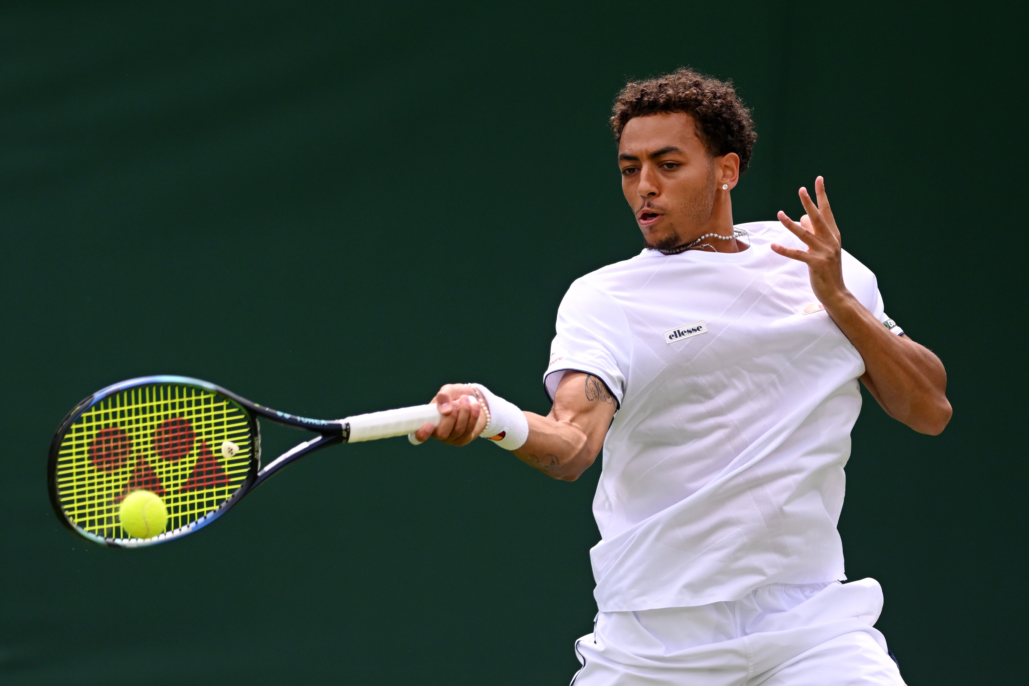 Paul jubb hitting a forehand at wimbledon
