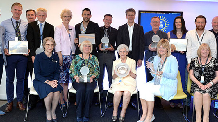 Group of people smiling with their awards
